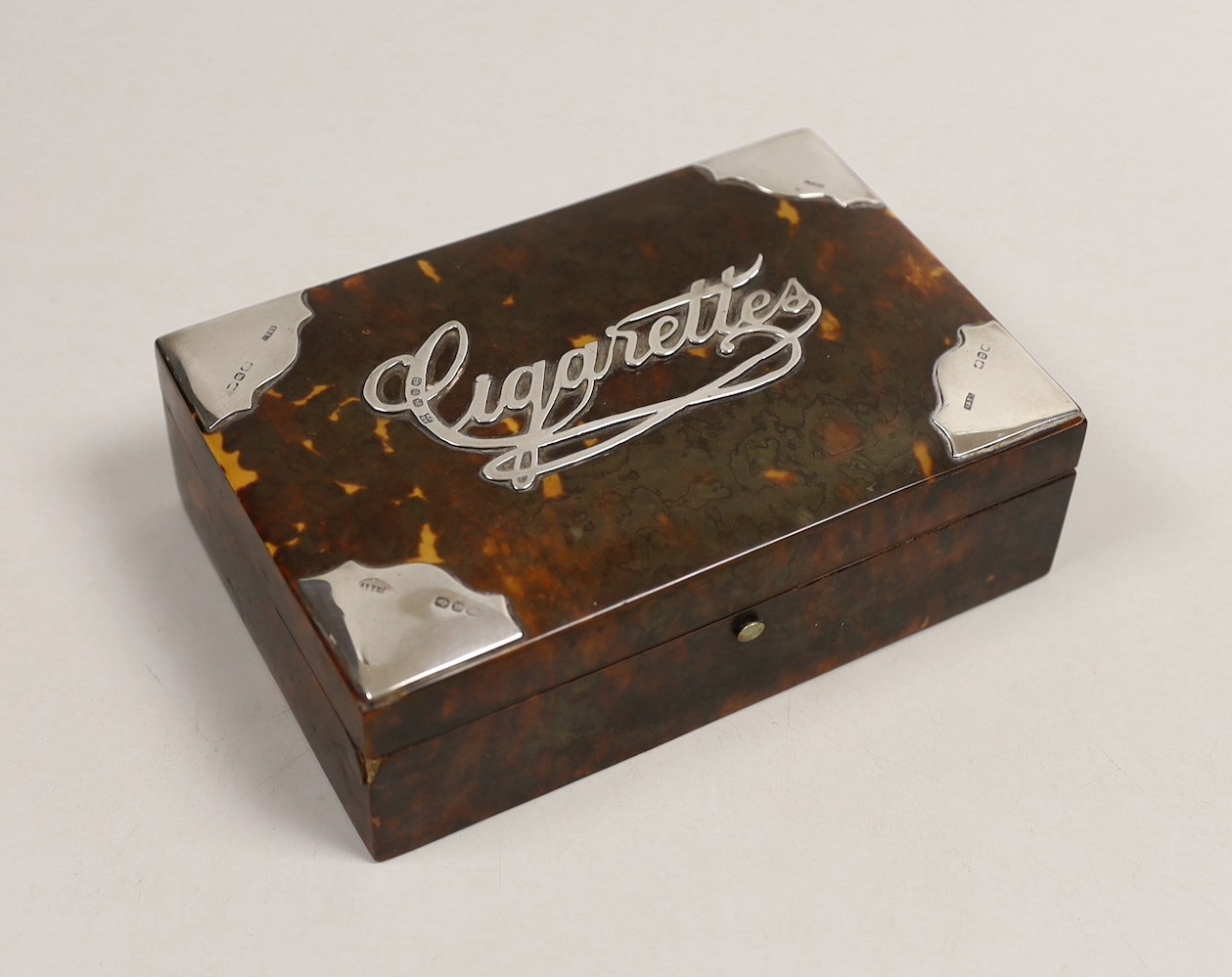 A late Victorian silver mounted tortoiseshell rectangular 'Cigarettes' box, A & J Zimmerman, Birmingham, 1896, 15.2cm.